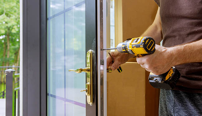 worker installing door