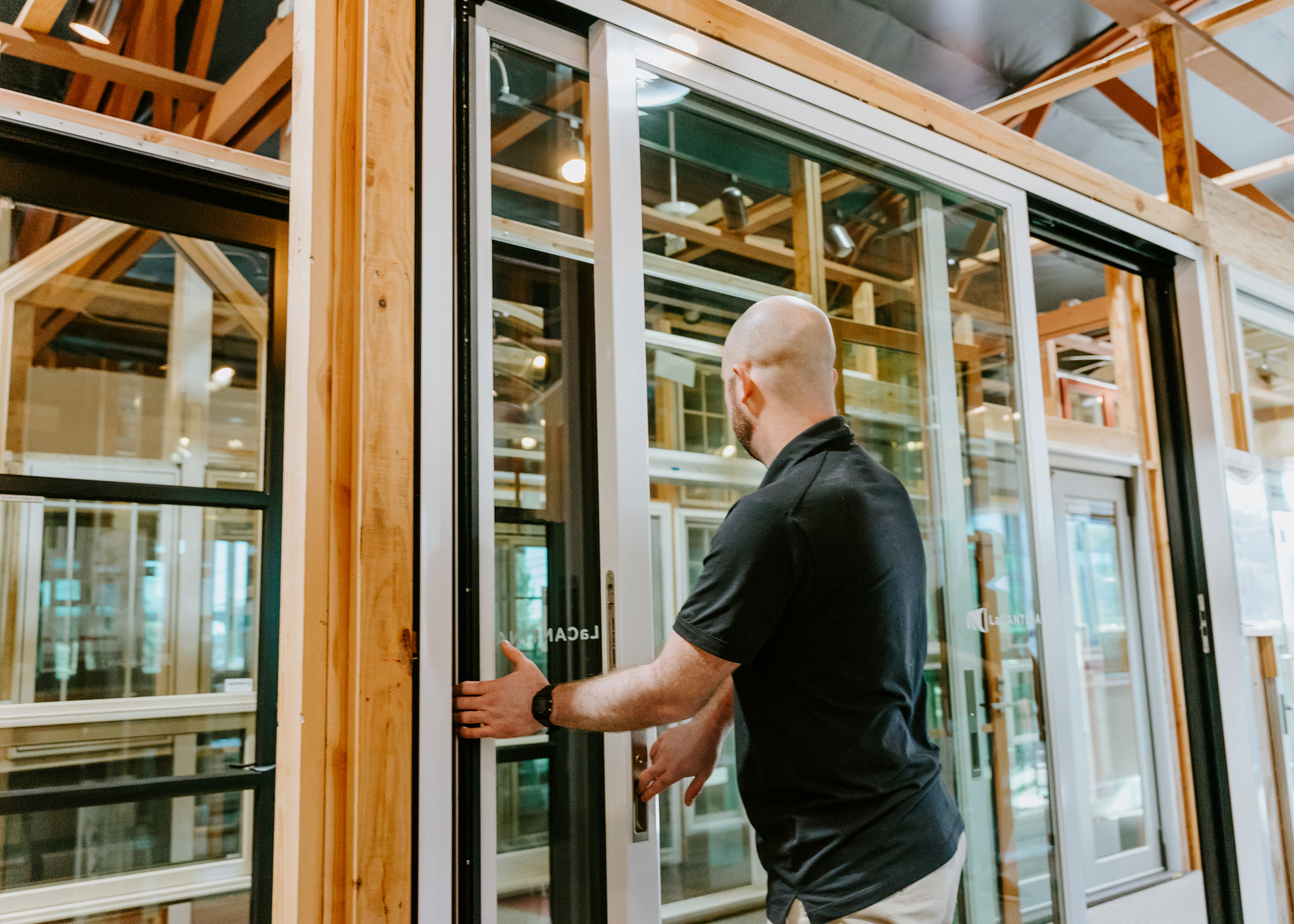 man opening a sliding door